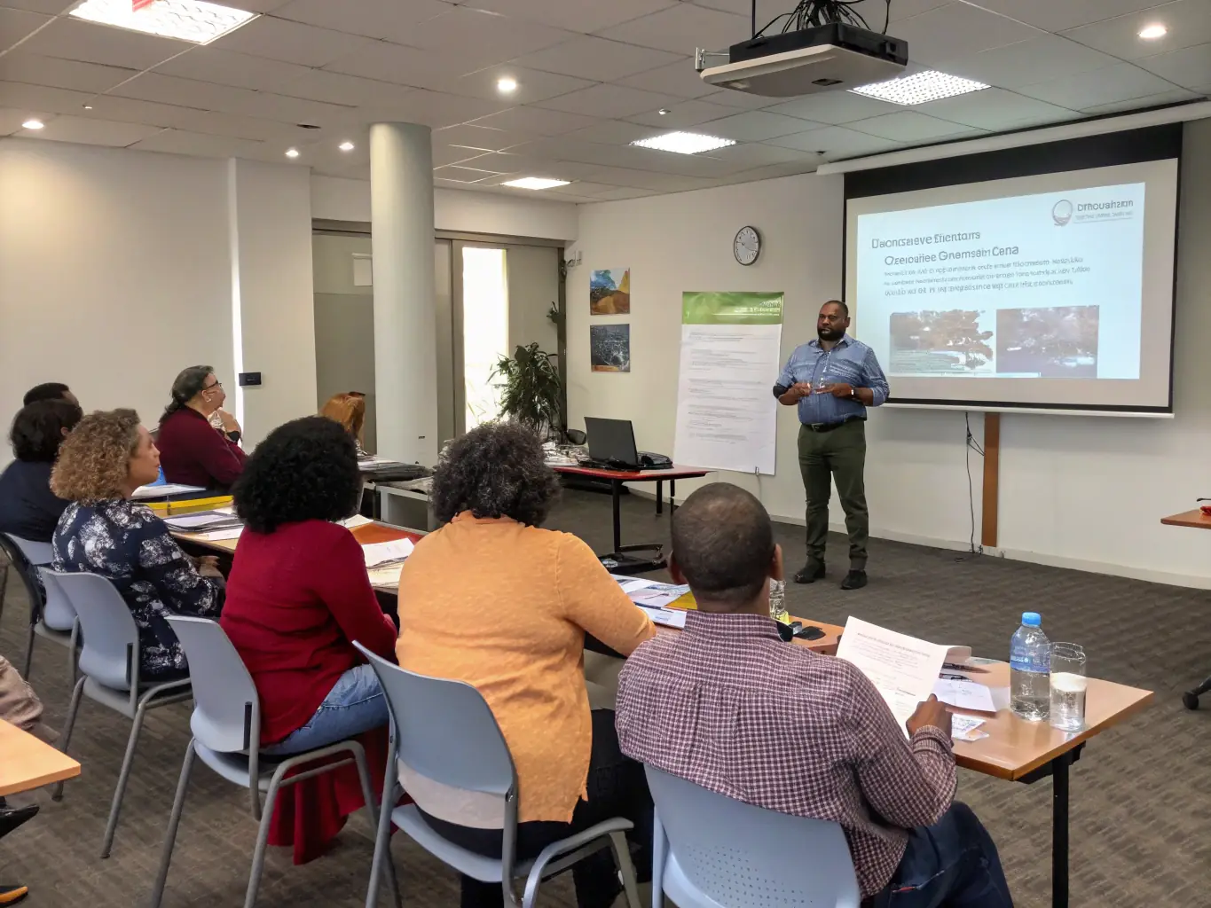 A diverse group of nonprofit professionals actively participating in a financial management training session, focusing on budgeting and reporting best practices.